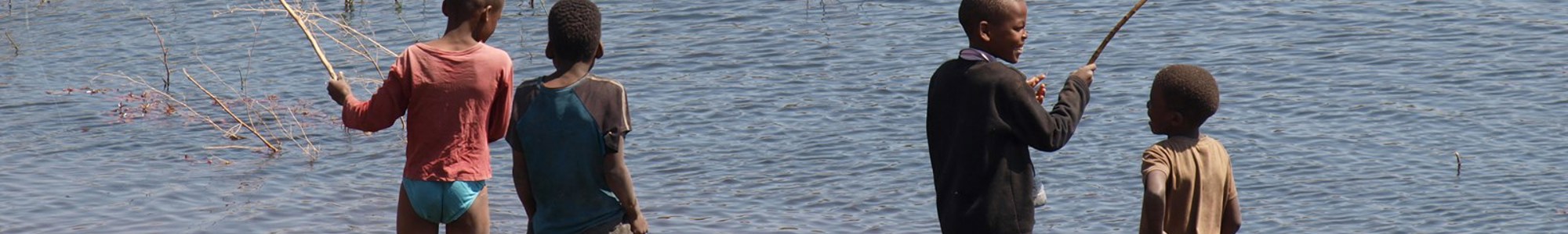 Four Boys Playing In The Thamalakane River Ns 06380